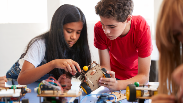 two students are playing robots